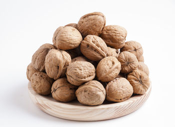 Close-up of cookies in bowl against white background