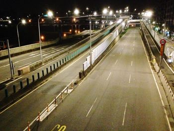 High angle view of illuminated road in city at night