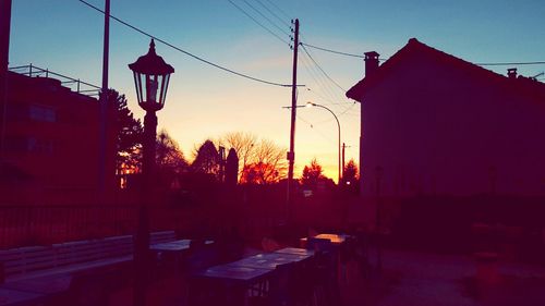 Buildings against sky at sunset