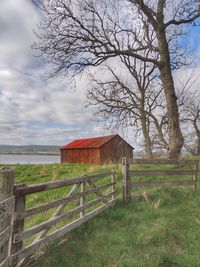 Built structure on field against sky