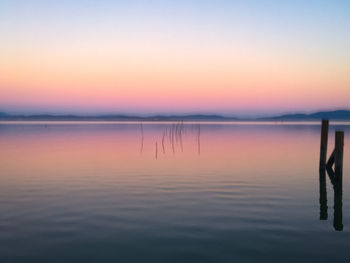 Scenic view of lake against sky during sunset