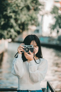 Woman photographing with camera