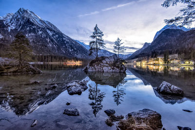 Reflection of trees in lake against sky