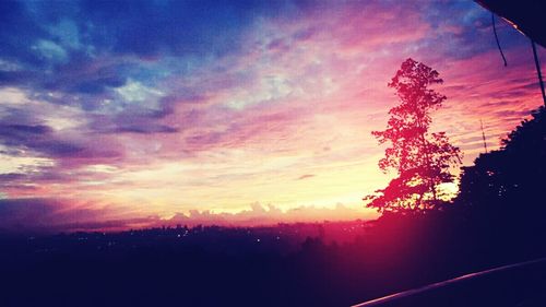 Scenic view of landscape against sky at sunset