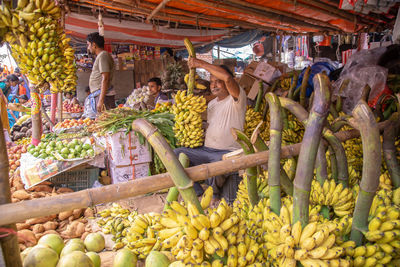 Group of people for sale at market stall