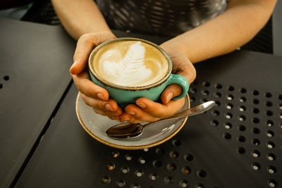 Man holding coffee cup