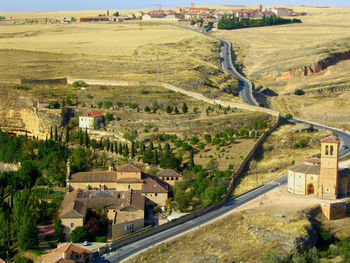 High angle shot of built structures on countryside landscape