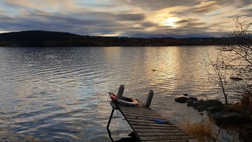 Scenic view of lake against sky during sunset