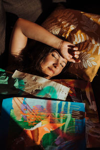 High angle view of woman lying on bed