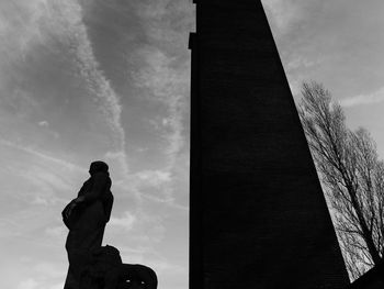 Low angle view of statue against sky