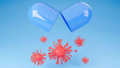 Low angle view of heart shape against blue sky