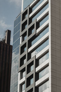 Low angle view of modern buildings against sky