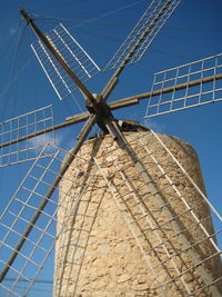 High section of windmills against clear sky