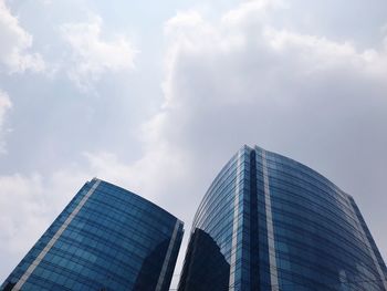 Low angle view of modern buildings against sky