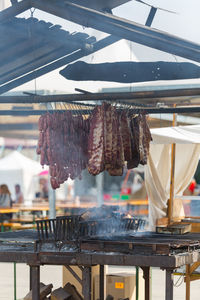 Clothes drying on barbecue grill at market