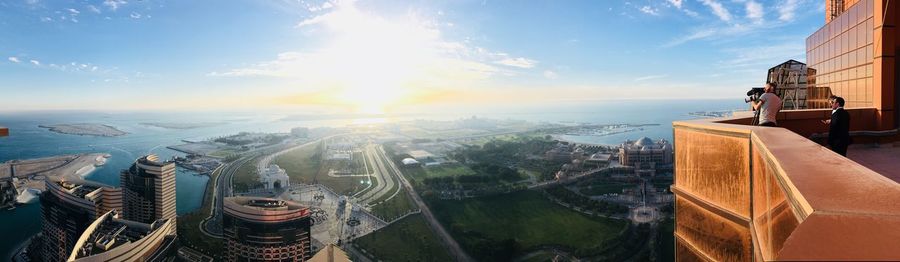 Panoramic view of buildings against sky during sunset