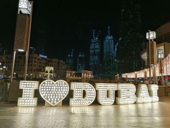 Illuminated buildings in city at night