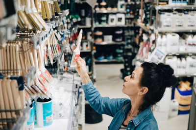 High angle view of senior woman shopping in hardware store