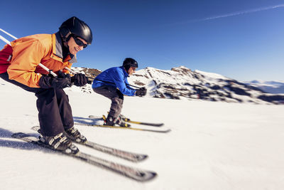 Austria, damuels, woman skiing in winter landscape