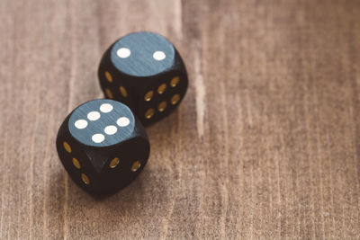 Close-up of black dices on table