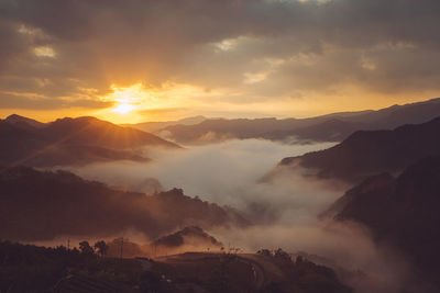 Panoramic view of mountains against sky during sunset