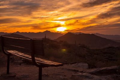 Scenic view of mountains against orange sky