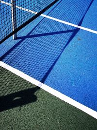 High angle view of shadow of tennis net 