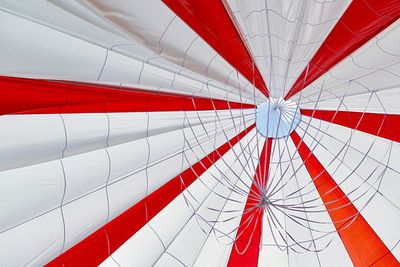 Low angle view of flags against sky