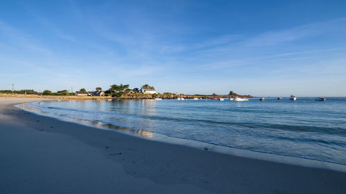 Scenic view of sea against blue sky