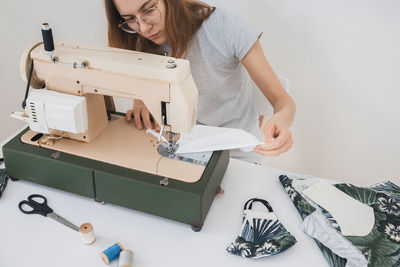 Midsection of woman working on table