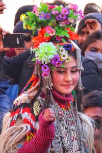 Portrait of people holding flowers