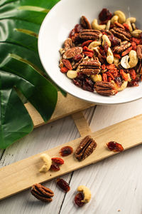 High angle view of mixed nuts in bowl on table