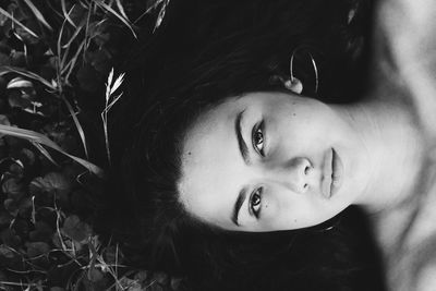 Close-up portrait of smiling young woman