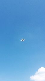 Low angle view of airplane flying in sky