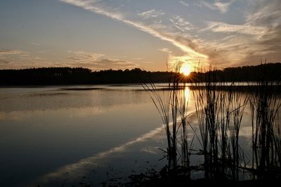 Scenic view of lake against sky during sunset