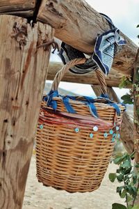 Midsection of man holding wicker basket