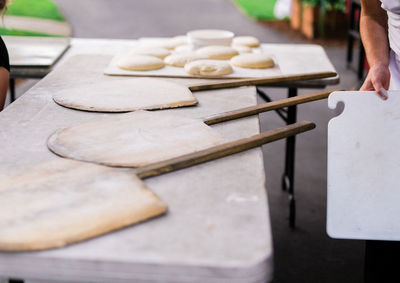 Midsection of person preparing food on table