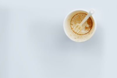 Directly above shot of coffee against white background