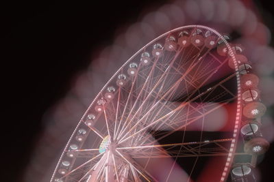 Close-up of illuminated ferris wheel