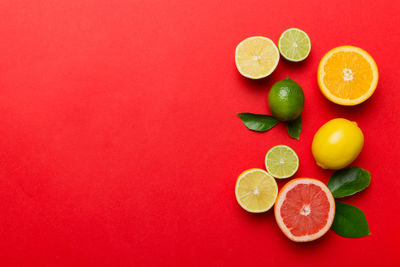 High angle view of fruits on yellow background