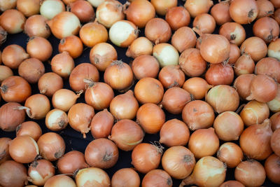 Full frame shot of onions for sale at market stall