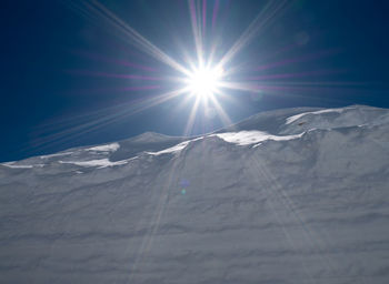 Scenic view of snowcapped mountains against sky during winter