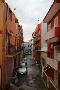 Houses in city against sky