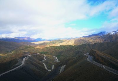 High angle view of mountain road against cloudy sky