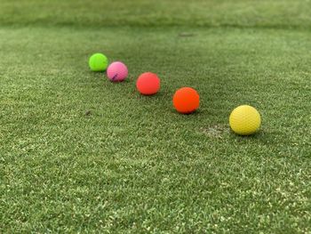 Close-up of multi colored ball on grass