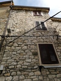 Low angle view of old building against sky