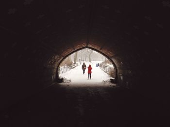 People walking in tunnel