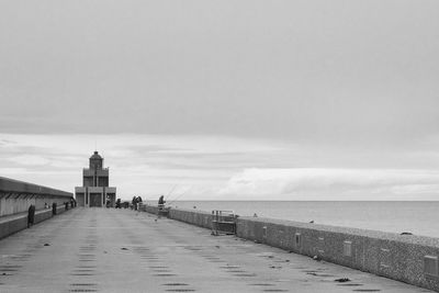 Scenic view of sea and buildings against sky