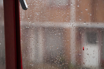 Full frame shot of wet window in rainy season