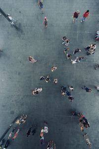 High angle view of people walking in city